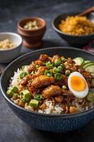 Chicken and rice bowl with egg and avocado photo