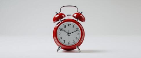 The vibrant red alarm clock highlighting the importance of time management in daily life. photo