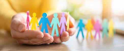 The colorful paper figures symbolizing unity and connection in a supportive community. photo