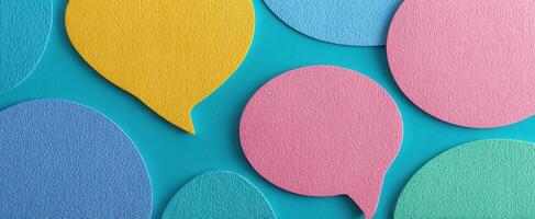 The colorful speech bubbles on a vibrant blue background create engaging communication. photo