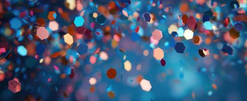 The Colorful Confetti Floating Through a Shimmering Blue Background photo