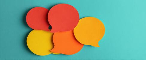 The colorful speech bubbles representing communication and dialogue on a vibrant background. photo