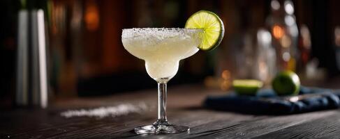 The refreshing margarita cocktail served in a classic glass with lime garnish. photo