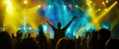 The vibrant concert atmosphere with an enthusiastic crowd enjoying the performance. photo