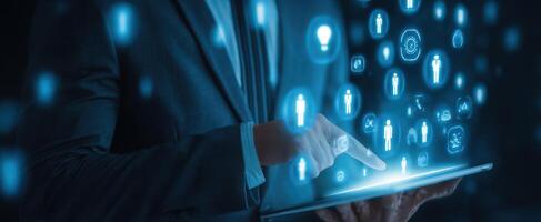 The digital tablet displaying futuristic networking icons in a modern business setting. photo