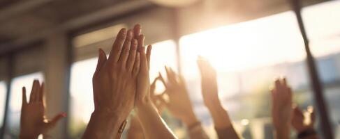 The hands applauding in a warm, vibrant atmosphere of celebration and community engagement. photo