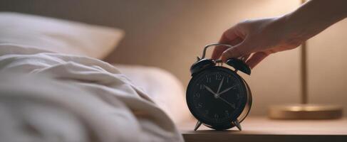 The alarm clock on the bedside table capturing morning tranquility. photo
