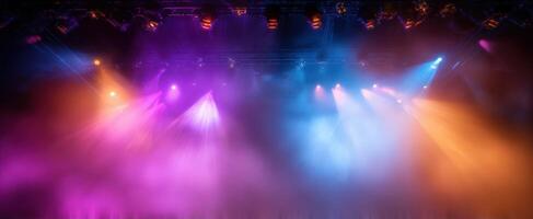 The vibrant stage illuminated by colorful lights and fog during a live performance photo