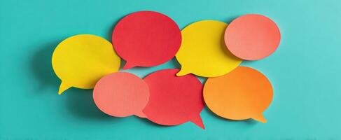 The collection of colorful speech bubbles on a vibrant background. photo