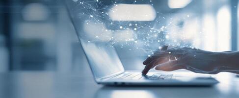 The laptop displaying a digital network with a hand interacting. photo