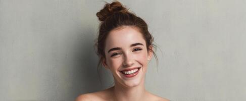 The joyful portrait of a young woman with a radiant smile. photo
