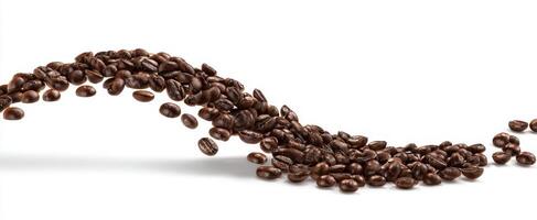 The flowing cascade of roasted coffee beans on a pristine background. photo