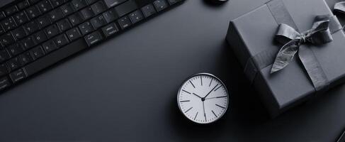 The elegant clock and gift arrangement on a sleek workspace. photo