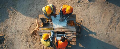 The construction team collaborates on project planning at a busy job site. photo