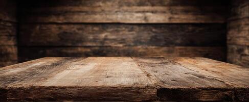The rustic wooden table surface in an inviting interior setting. photo