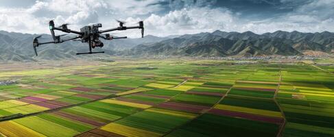 The drone flying over vibrant agricultural fields in a mountainous landscape. photo