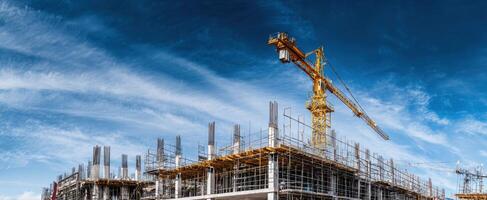 The construction process showcasing a tall crane against a dramatic sky backdrop. photo