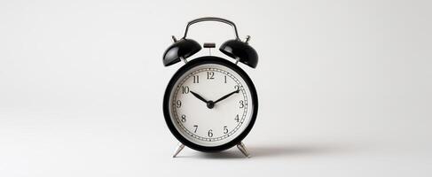 The classic alarm clock representing time management and punctuality in a minimalist setting. photo