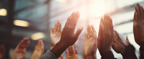 The hands raised in celebration at a dynamic event showcasing community support. photo