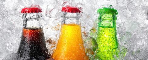 The vibrant assortment of cold beverages covered in ice and condensation. photo