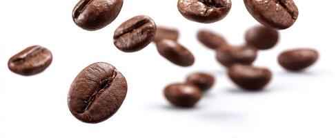 The coffee beans gracefully falling against a pristine white background. photo
