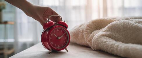 The vintage red alarm clock signaling the start of a new day. photo