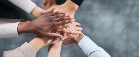 The united hands symbolizing teamwork and collaboration in a diverse community setting. photo