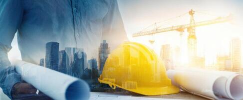 The construction helmet and blueprints showcasing urban development and engineering excellence. photo