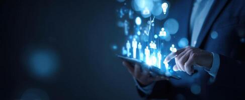 The businessman interacting with advanced digital networking on a tablet. photo