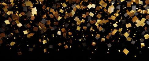 The shimmering gold confetti creating a vibrant festive atmosphere on a black background photo