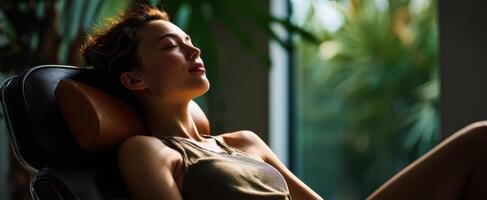 The serene woman enjoying relaxation in a peaceful indoor environment. photo