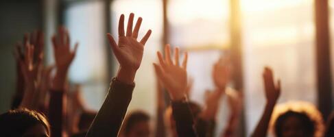 The hands raised in a moment of collective engagement and community support. photo