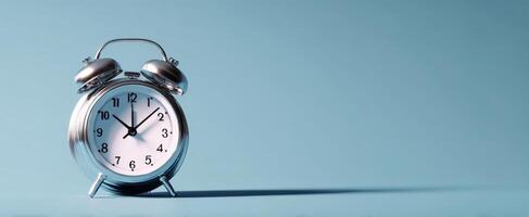 The Vintage Silver Alarm Clock in a Minimalist Style Setting photo