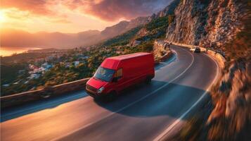 The red van navigating a winding road during a dramatic sunset. photo