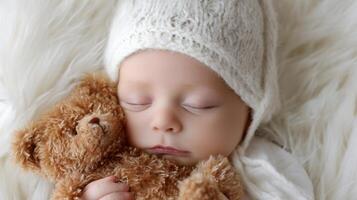 The sleeping baby cuddling a teddy bear in a cozy environment. photo