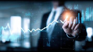 The business professional analyzing market trends with digital graphs and charts. photo