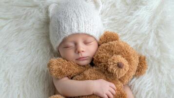 The peaceful baby sleeping with a soft teddy bear in a cozy setting. photo