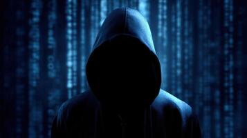 The mysterious hacker cloaked in shadows against a backdrop of binary code. photo