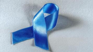 The blue ribbon symbolizing awareness and support for various causes. photo