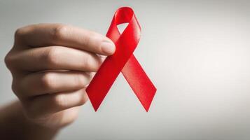 The red ribbon symbolizes awareness and support for HIV and AIDS prevention efforts. photo