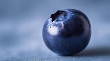 The vibrant blueberry with exquisite detail on a soft blue background photo