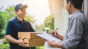 The delivery man handing packages to a smiling customer at the doorstep. photo