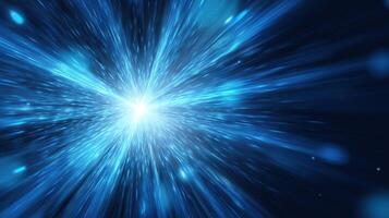 The vibrant explosion of blue light creating a cosmic abstract background. photo