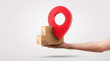The hand holding a location pin over stacked delivery boxes. photo