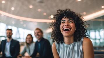 The joyful woman laughing with colleagues in a modern office environment. photo