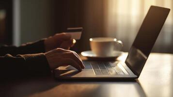 The laptop and coffee setup for online shopping and transactions. photo