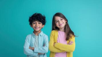 The happy children posing together with arms crossed in vibrant colors photo