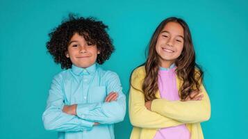 The joyful children with bright smiles posing in colorful casual outfits. photo
