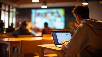 The student engaging with technology during an informative classroom presentation. photo