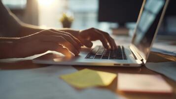 The hands typing on a laptop, capturing the essence of modern productivity. photo